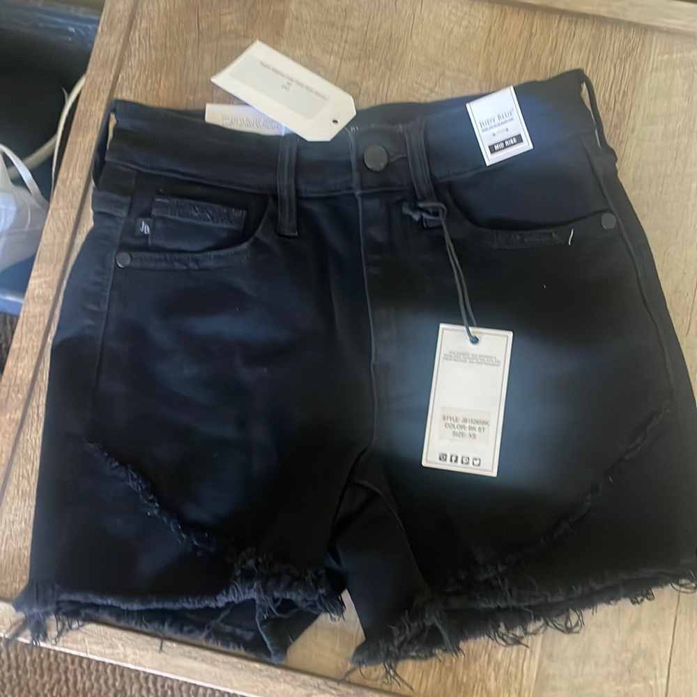 Midrise fray tulip hem shorts